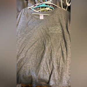 Stars above grey tshirt with “waiting for the weekend”